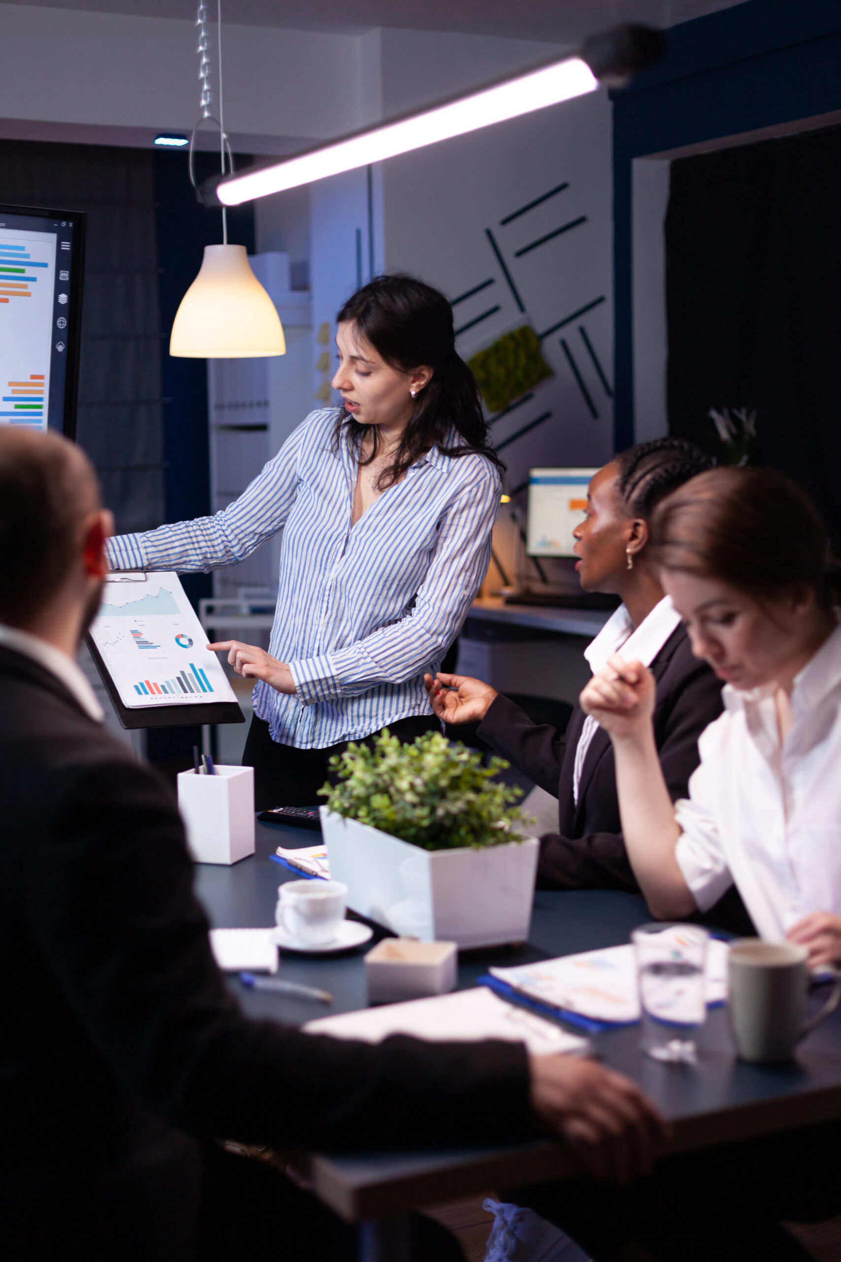 overworked focused diverse businesspeople working in business company meeting office room